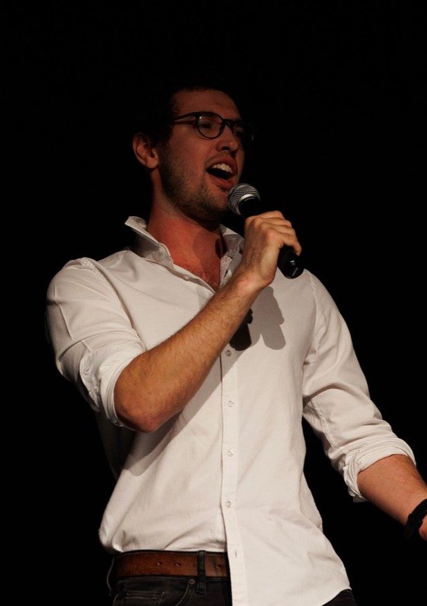 A student performing with a microphone