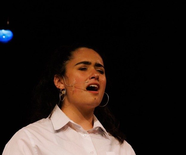 A student singing a solo